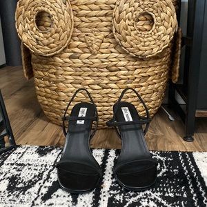 Strapped black heels